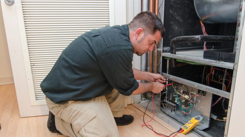 What are the reasons behind the heat pump tripping the circuit breaker?